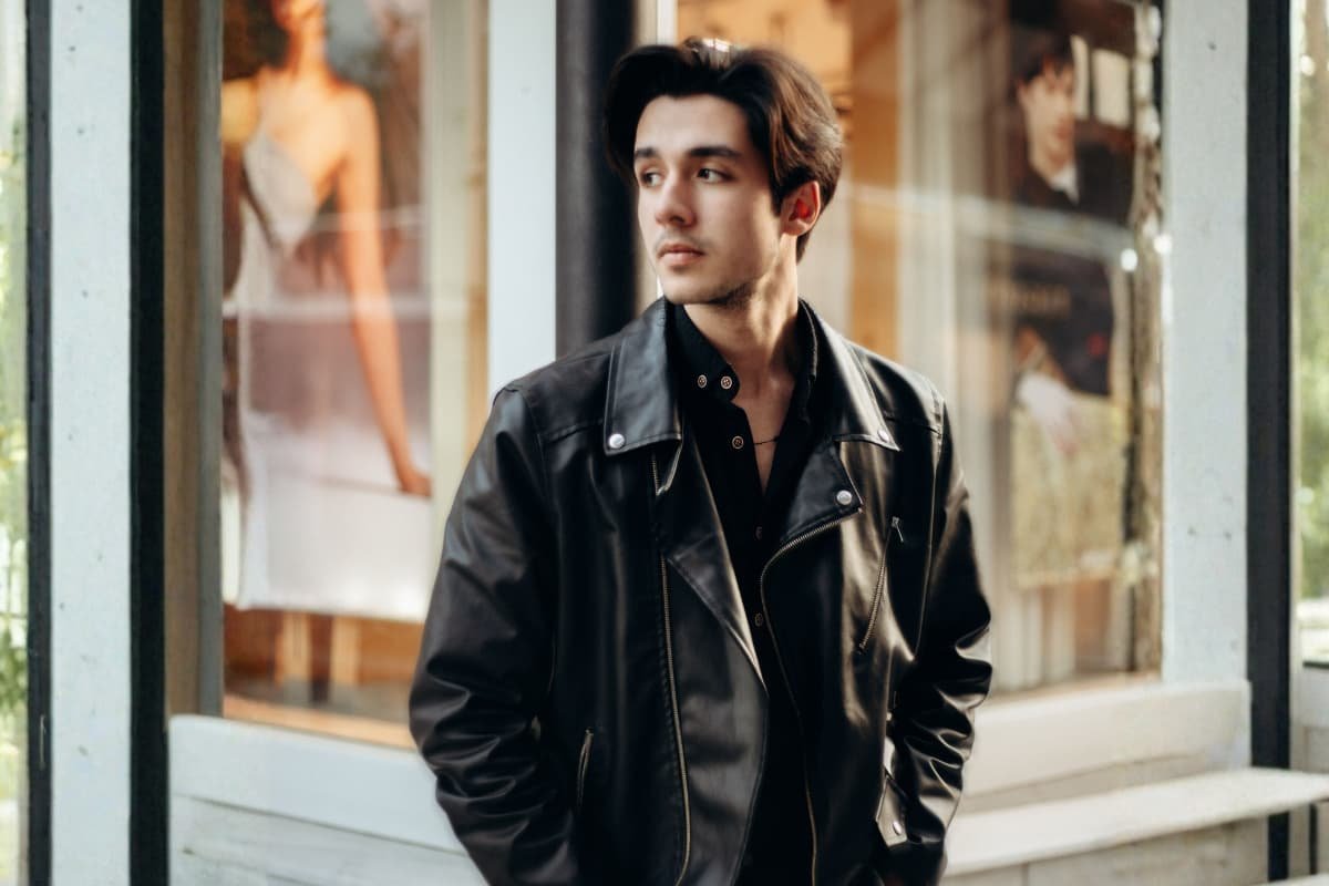 Man wearing black leather jacket street style