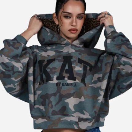GAP x KATSEYE Daniela camouflage hoodie worn by a woman