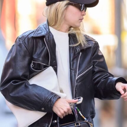 Gigi Hadid wearing black leather jacket, side view