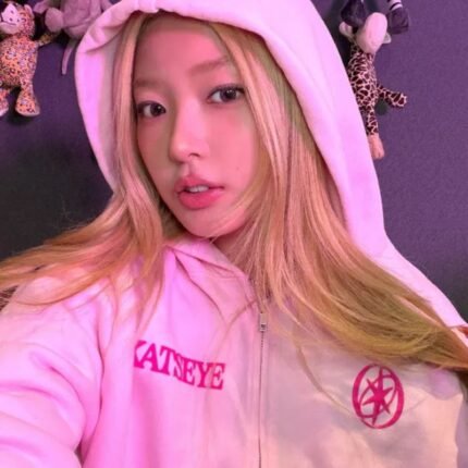 Katseye Desert pink zip-up hoodie worn by a woman
