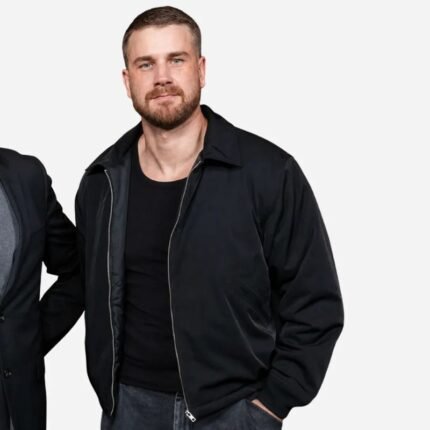 Black zip-front jacket styled with a black shirt and dark trousers