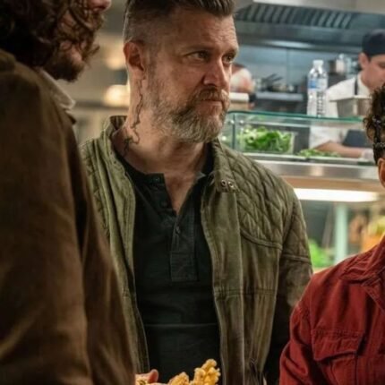 Shane McRae wearing a green quilted jacket in a Silo Season 3 scene