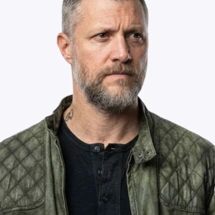 Shane McRae wearing a green quilted Silo jacket with a snap-tab collar