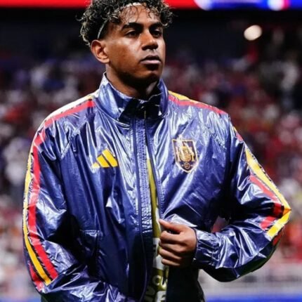 Blue Spain football jacket worn with red and yellow sleeve stripes