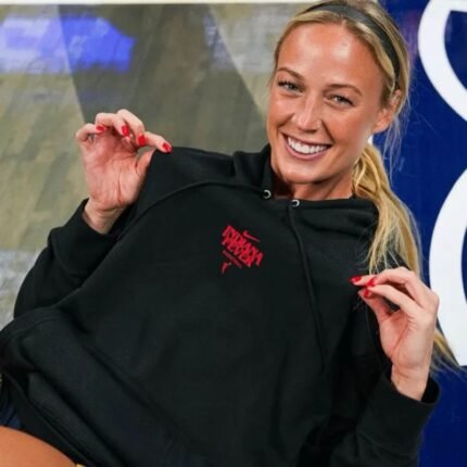 Sophie Cunningham Hoodie in black worn with hood and red chest graphic visible