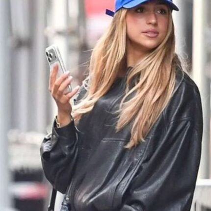 Tate McRae wearing a black leather jacket in New York City