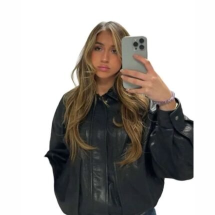 Tate McRae wearing an oversized black leather jacket