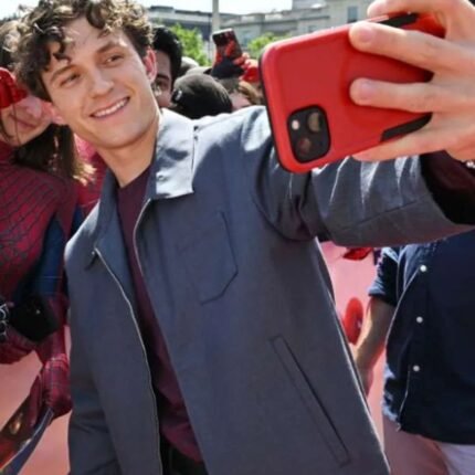 Tom Holland wearing grey jacket with front pockets