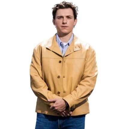 Tom Holland wearing a tan leather jacket with a classic buttoned design.