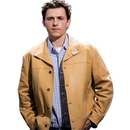Tom Holland wearing a tan leather jacket with a buttoned front and shirt collar.