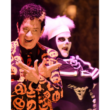 Man wearing the David S. Pumpkins costume suit at an event