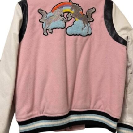 Back view of a pink varsity jacket with white leather sleeves, black shoulder panels, and rainbow cloud artwork.