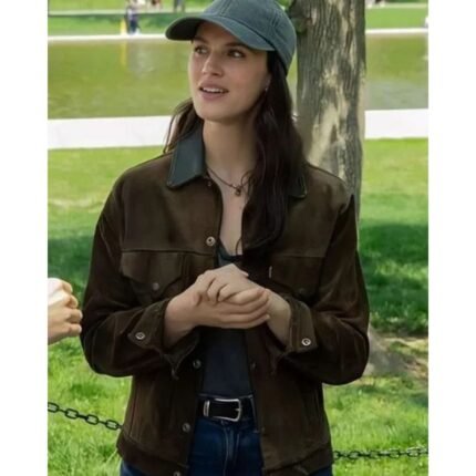 Jessica Brown Findlay wearing a brown suede jacket with a dark collar and front button closure