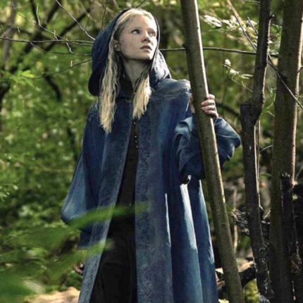 Freya Allan as Ciri wearing a blue hooded coat in The Witcher