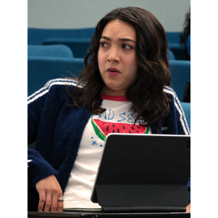 Anh Pham wearing the blue 3-Stripes cardigan with white sleeve stripes over a graphic T-shirt in The Love Hypothesis.