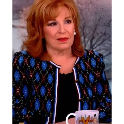 Joy Behar wearing a multicolor argyle cardigan with blue and burgundy diamond patterns on The View.