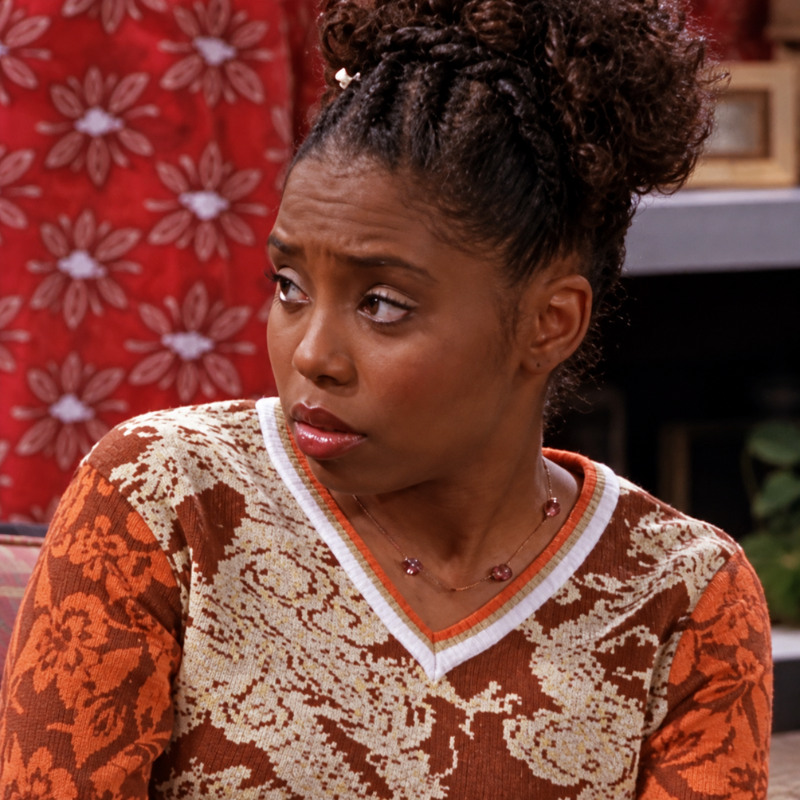 Niecy-jackson-moesha-season-5-dragon-pattern-sweater Niecy Jackson inspired brown and cream dragon pattern sweater with orange floral sleeves and a contrasting V-neck.