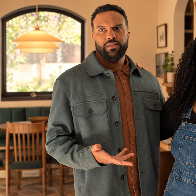 dennis-sampson-no-good-deed-blue-green-suede-jacket-copy-seo-setup Dennis Sampson No Good Deed Season 1 blue green jacket styled with a brown shirt in a casual indoor setting.